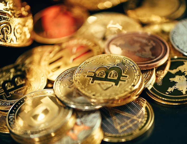 Gold-colored digital currency coins